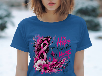 Blue t-shirt with graphic of woman, pink ribbon, wings, and text "Hope Gives Her Wings".