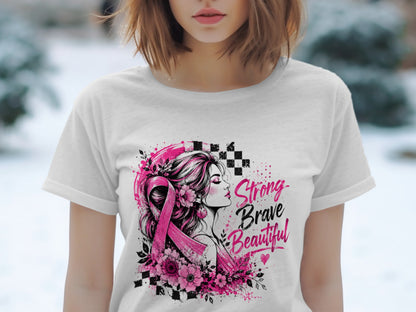 White t-shirt with pink ribbon, flowers, woman silhouette, and "Strong Brave Beautiful" text.