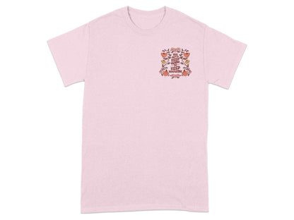 Pink t-shirt with floral design and text "You gotta keep going to keep growing."