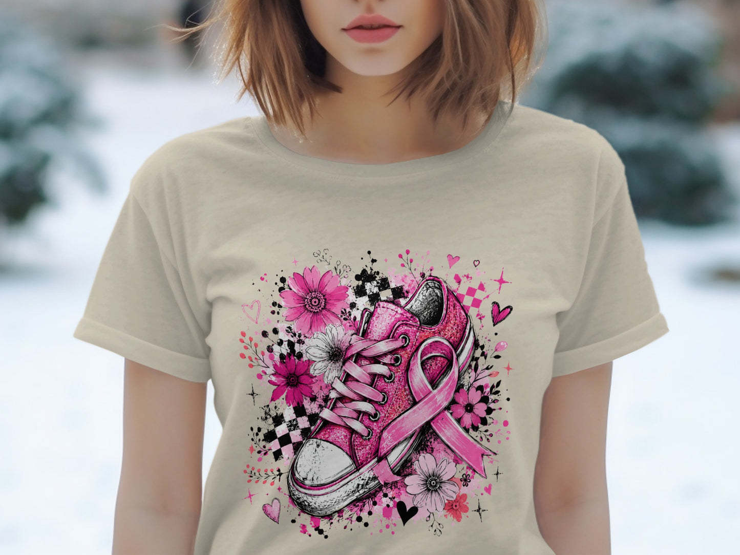 Pink sneaker with a breast cancer ribbon surrounded by flowers and hearts.