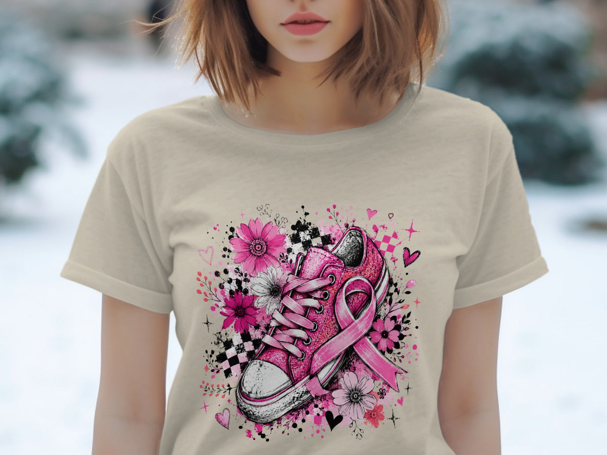 Pink sneaker with a breast cancer ribbon surrounded by flowers and hearts.