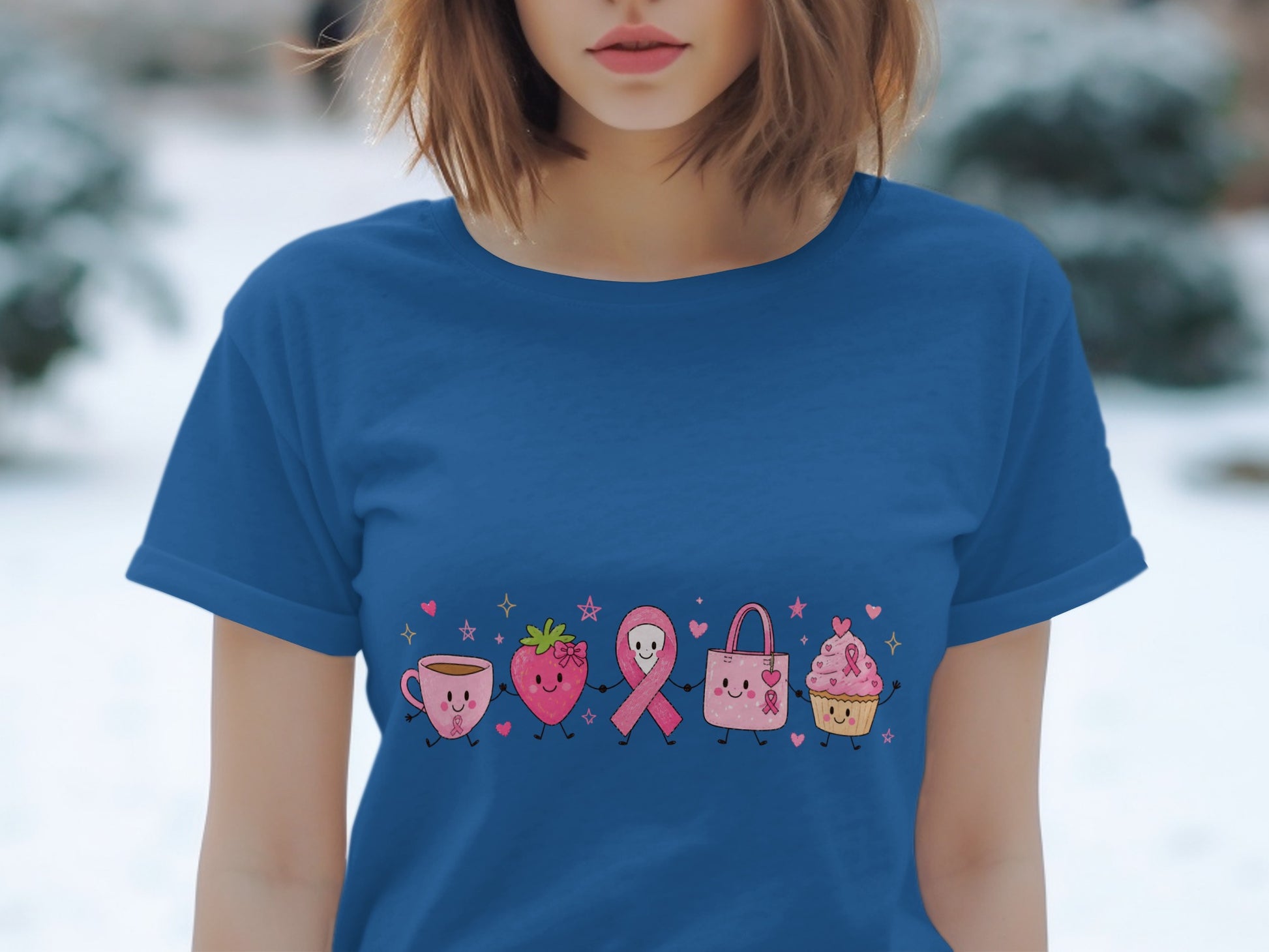 Blue t-shirt with cartoon coffee cup, strawberry, ribbon, purse, and cupcake.