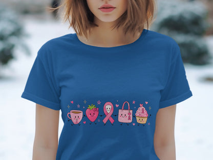 Blue t-shirt with cartoon coffee cup, strawberry, ribbon, purse, and cupcake.