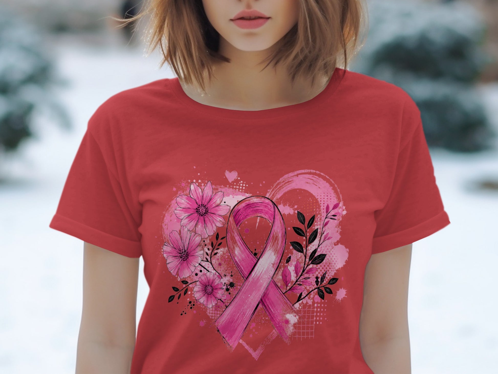 Red t-shirt featuring a pink ribbon with flowers and leaves against a textured heart.