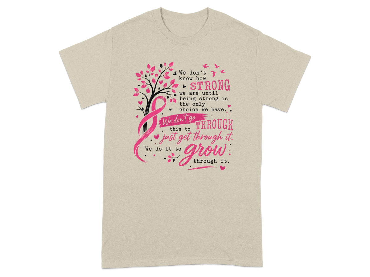 Light tan t-shirt with pink ribbon tree and inspirational text about strength and growth.