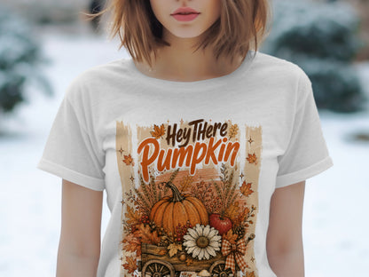 White t-shirt with "Hey There Pumpkin" text and a rustic autumn harvest scene.