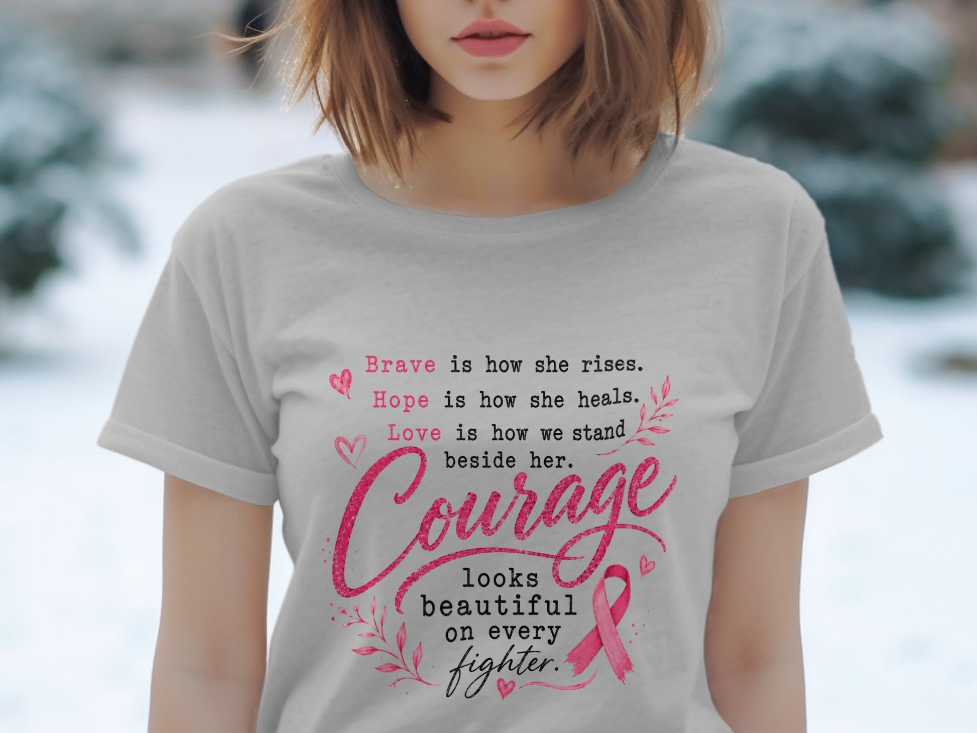 Light gray t-shirt with pink text about courage, hope, and bravery, featuring a pink ribbon.