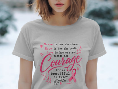 Light gray t-shirt with pink text about courage, hope, and bravery, featuring a pink ribbon.