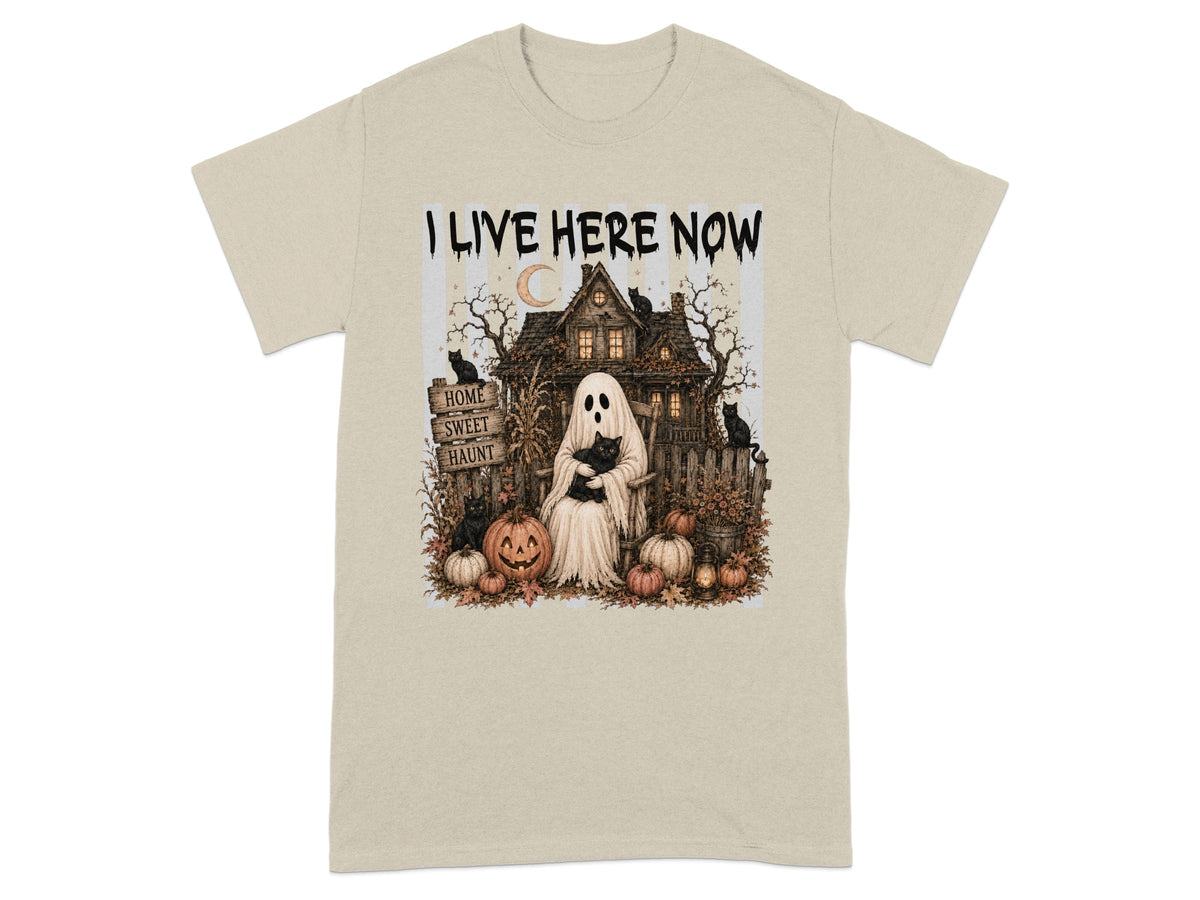 Ghost with cat and pumpkins in front of a haunted house, text says "I LIVE HERE NOW."