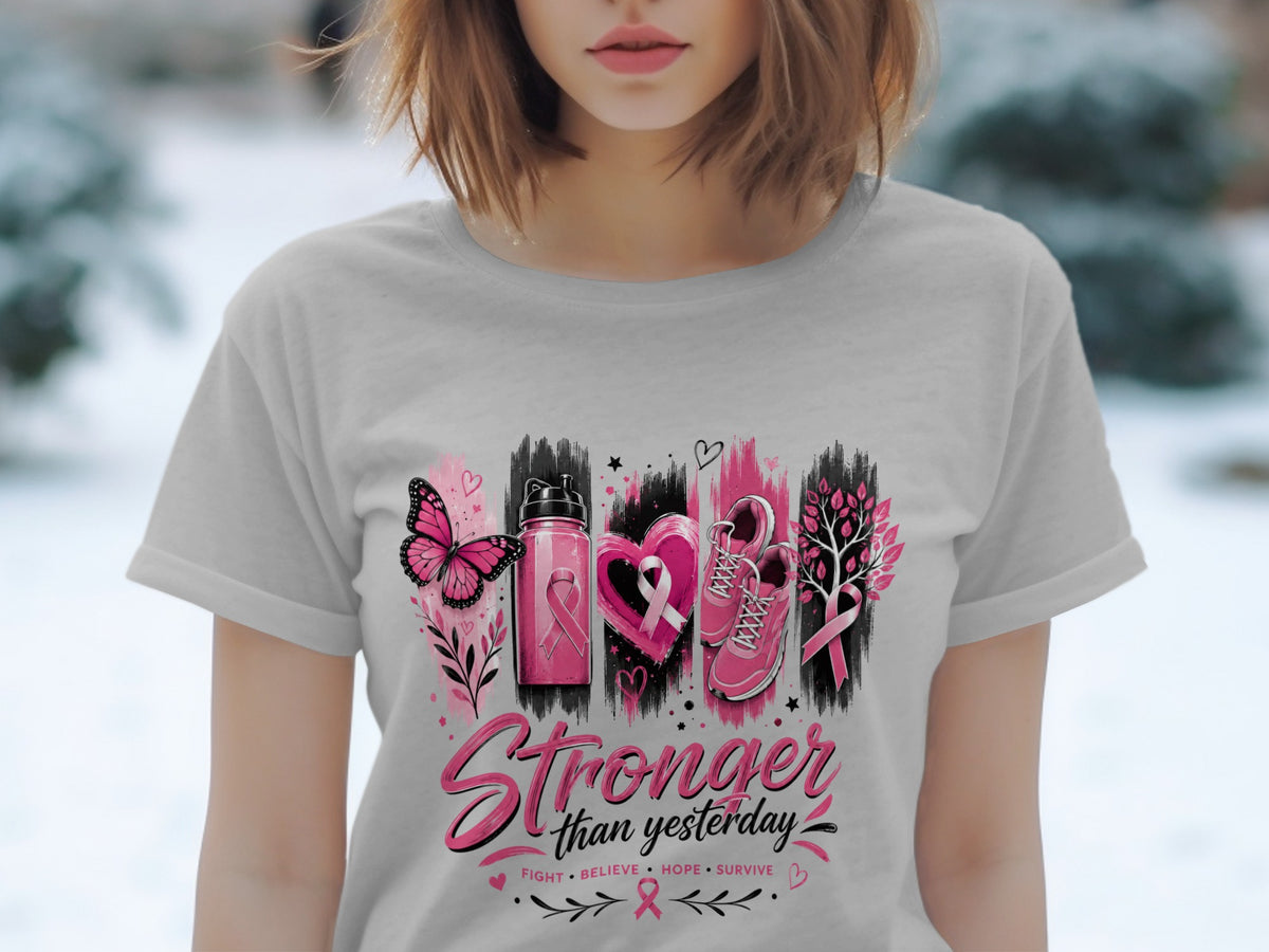 Gray t-shirt with "Stronger than yesterday" text and breast cancer awareness symbols.