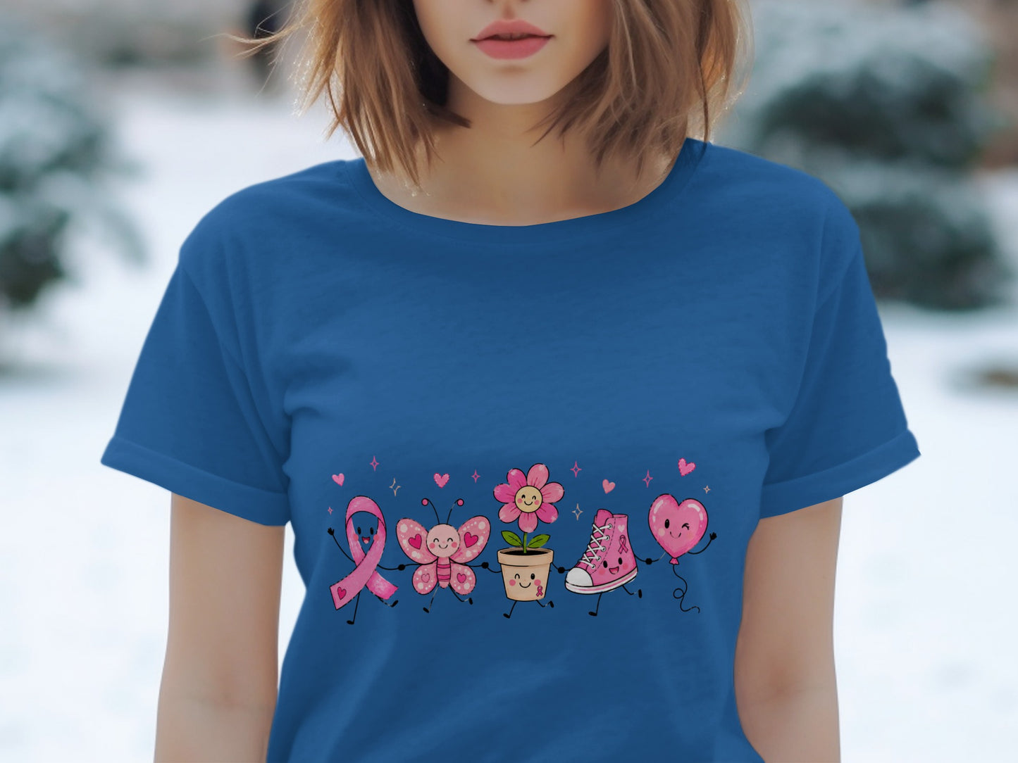 Blue t-shirt with cute pink ribbon, butterfly, flower, shoe, and heart balloon graphic.