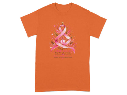 Orange t-shirt with breast cancer awareness graphic featuring a ribbon Christmas tree and inspirational text.