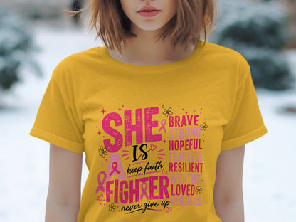 Yellow t-shirt with "She is a fighter" and inspirational words.